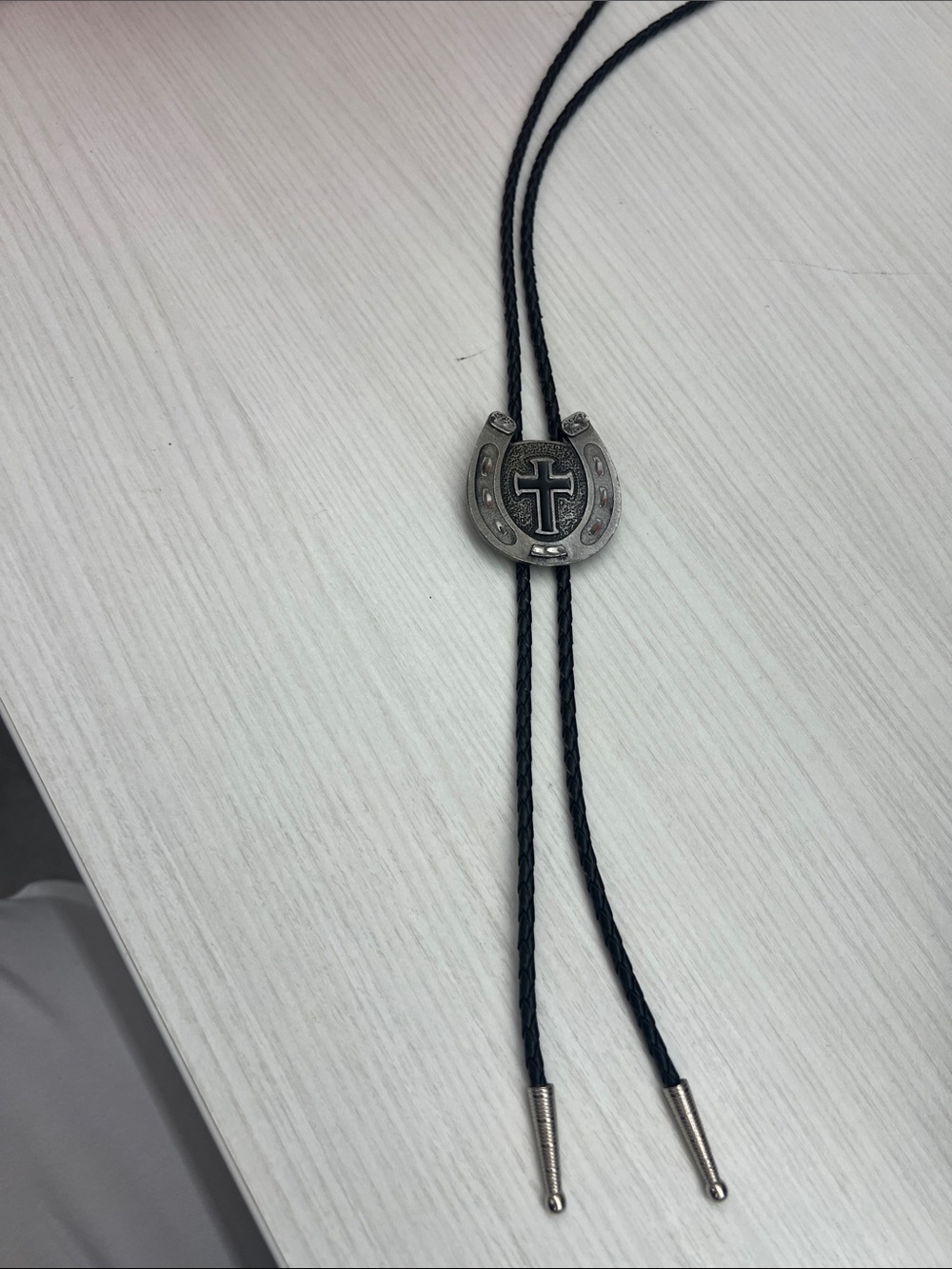 Black Braided Bolo Tie with Horseshoe Cross Accent